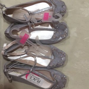 This is 2 pairs new shoes.Size 2 silver $20.ea